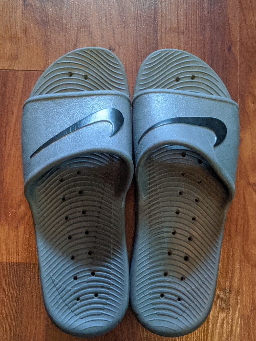 Nike Gray Slide Sandals with Black Swoosh